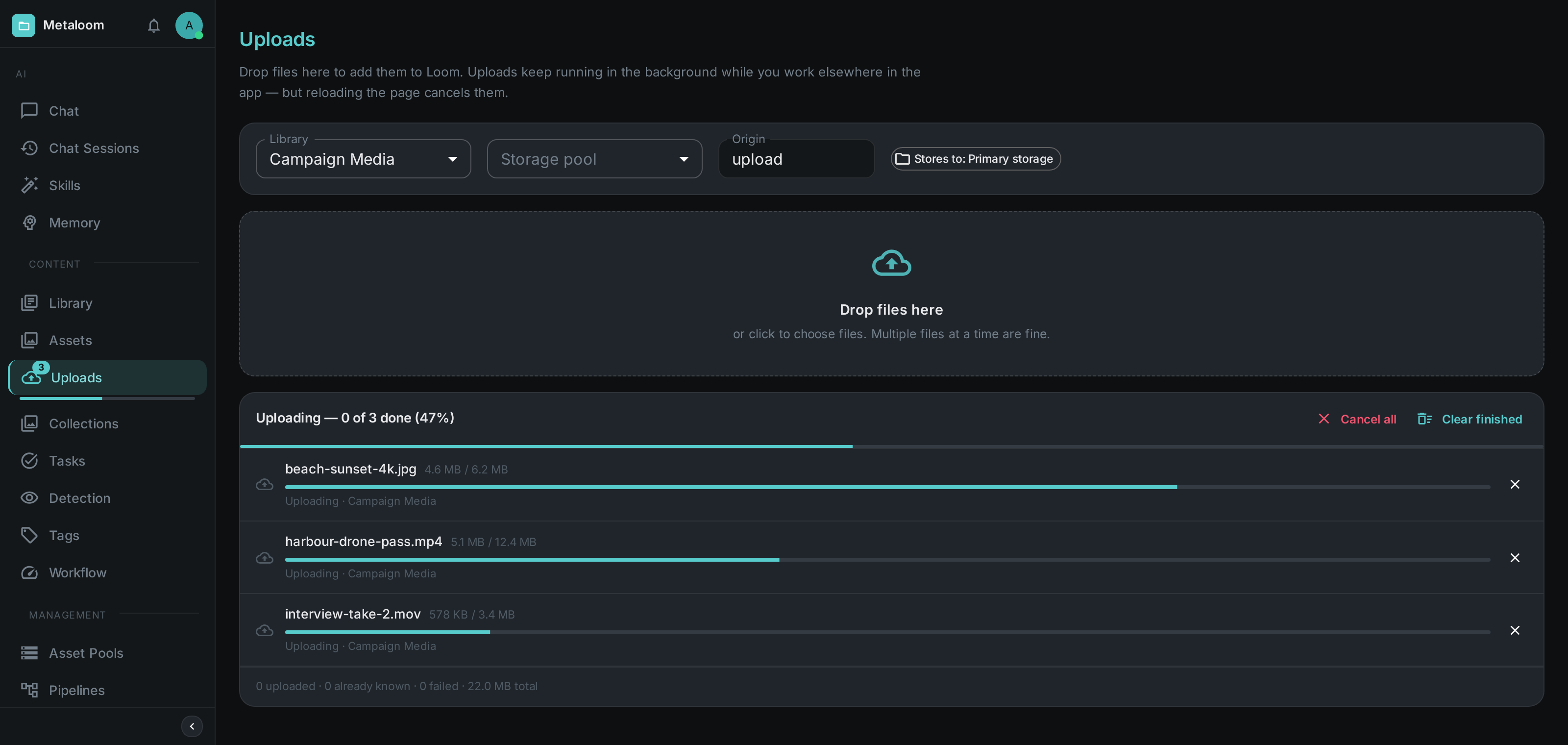 Three files uploading at once on the Uploads screen — a per-file progress bar for each and a combined bar above them